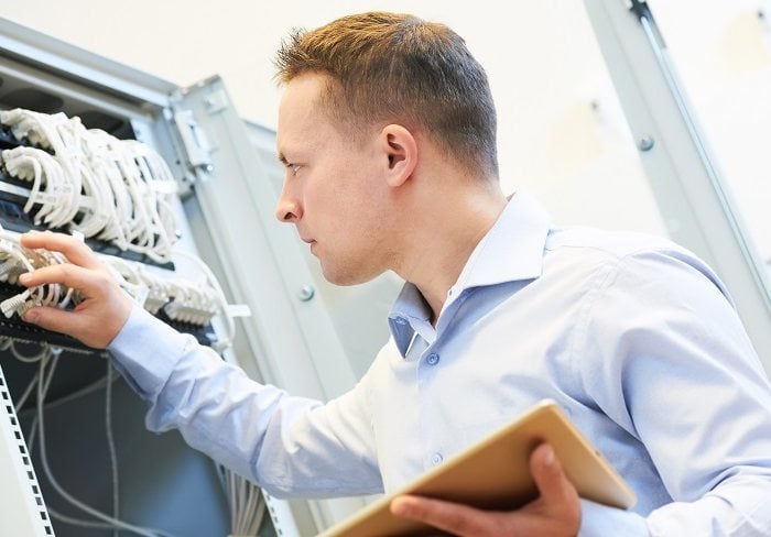 Networking service. network engineer administrator checking server hardware equipment of data center