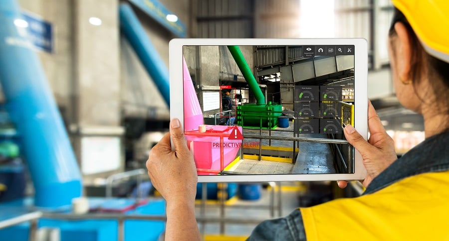 Industrial 4.0 , Augmented reality concept. Hand holding tablet with AR service , maintenance application and calling technician for check destroy part of smart machine in smart factory background.