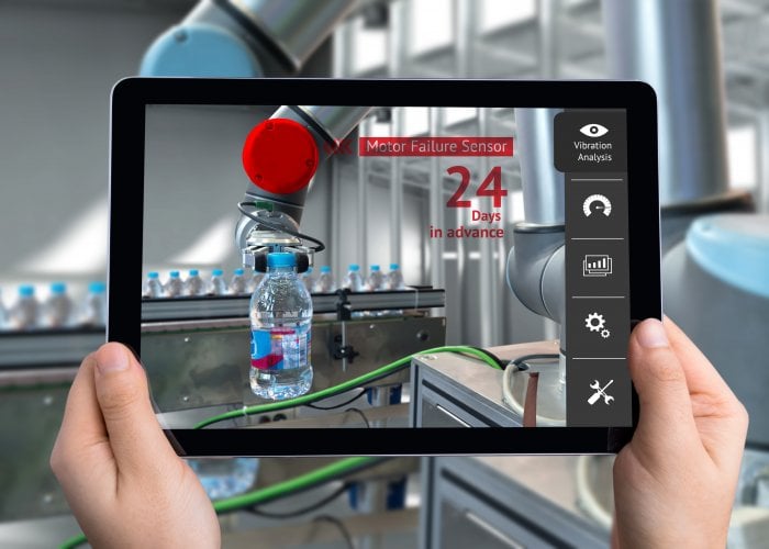 Predictive analytics Engineer hand using tablet, automation robot arm machine in smart factory with tablet real time vibration analysis monitoring system application for check motor failure. Industry 4th sensor concept.